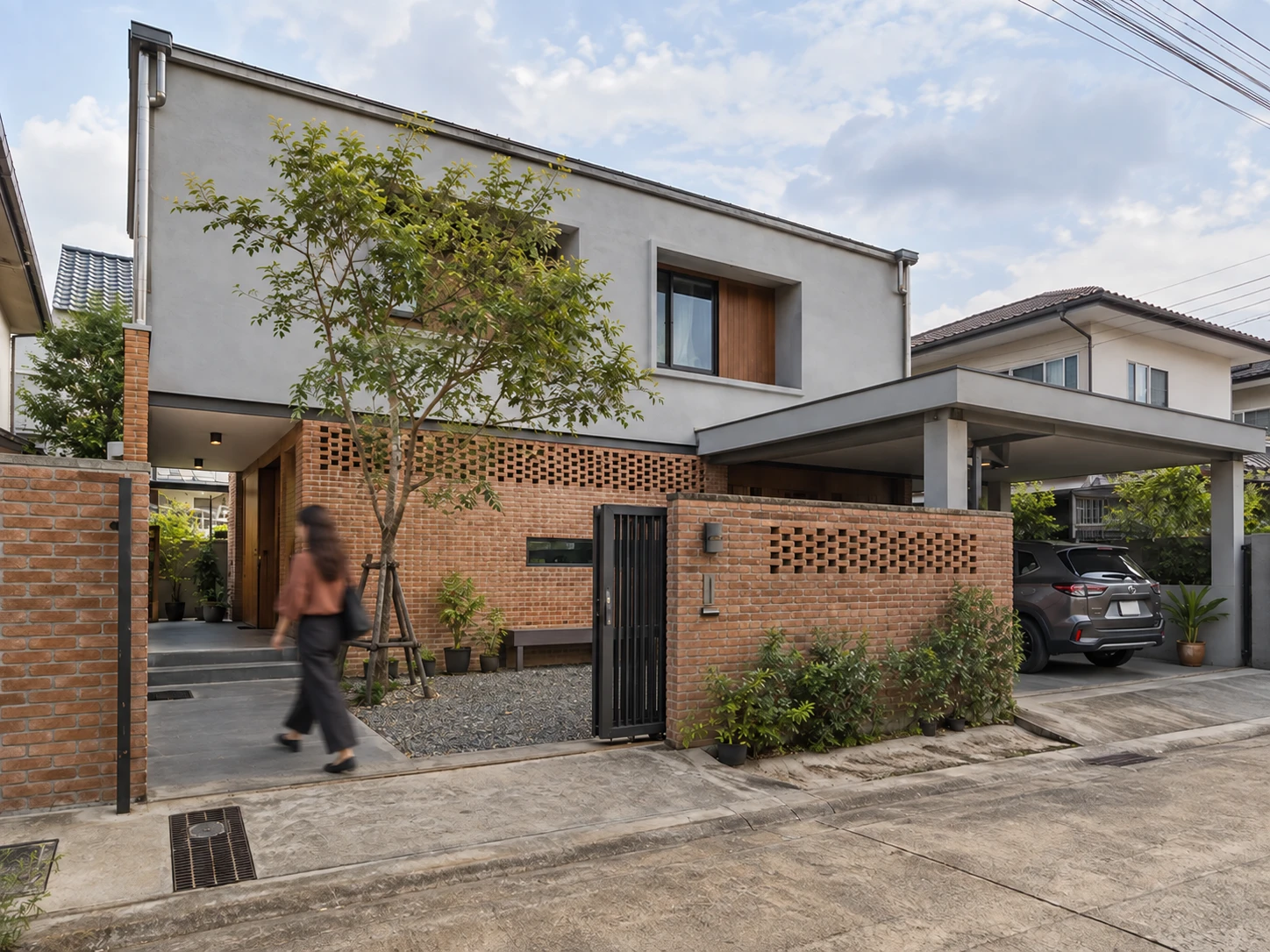 Exterior 3D render: two-storey house with brick screen wall, grey render, carport and street tree